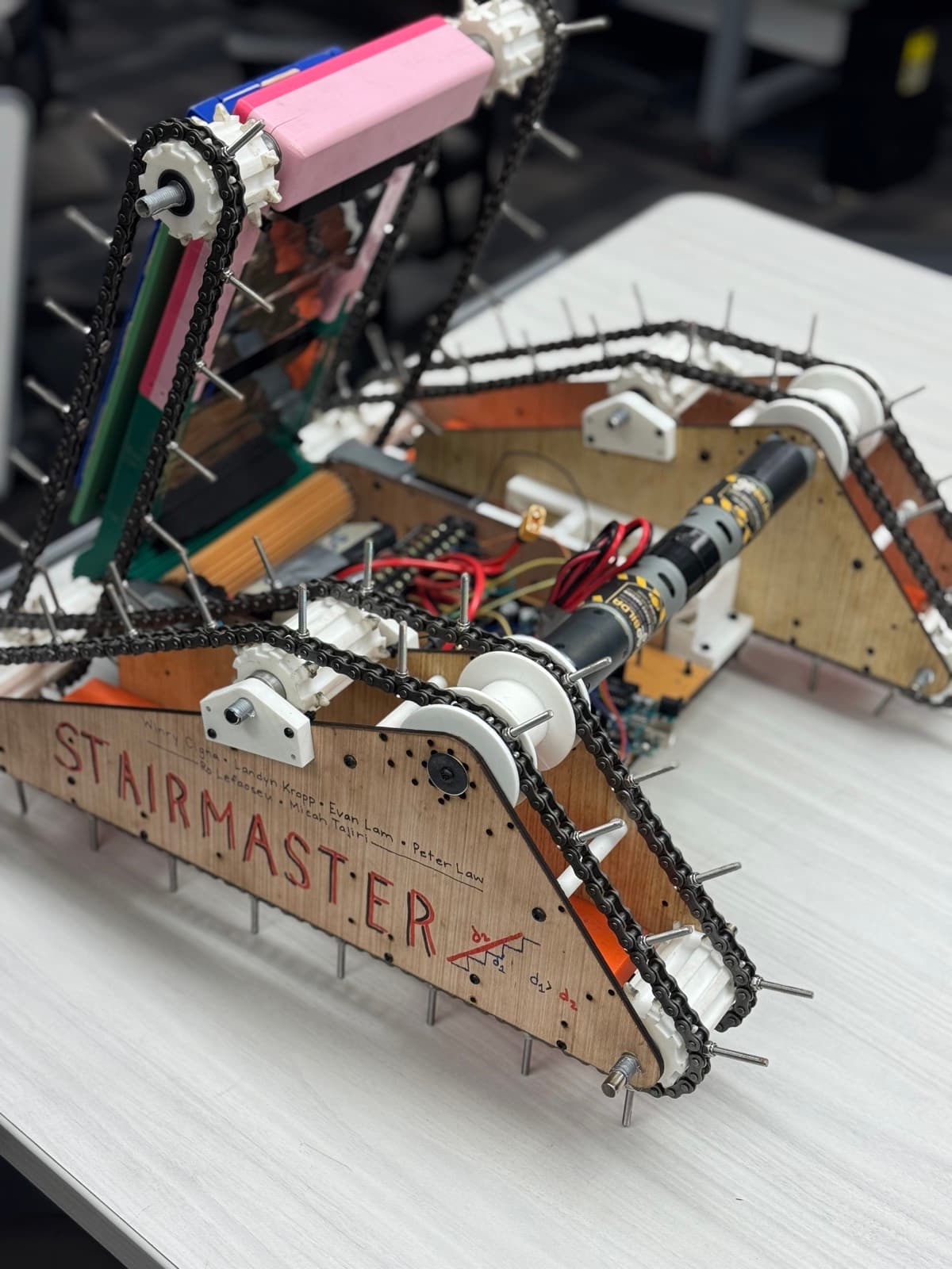 STAIRMASTER — lasercut side panel, chain-drive spiked tracks, team roster signed on