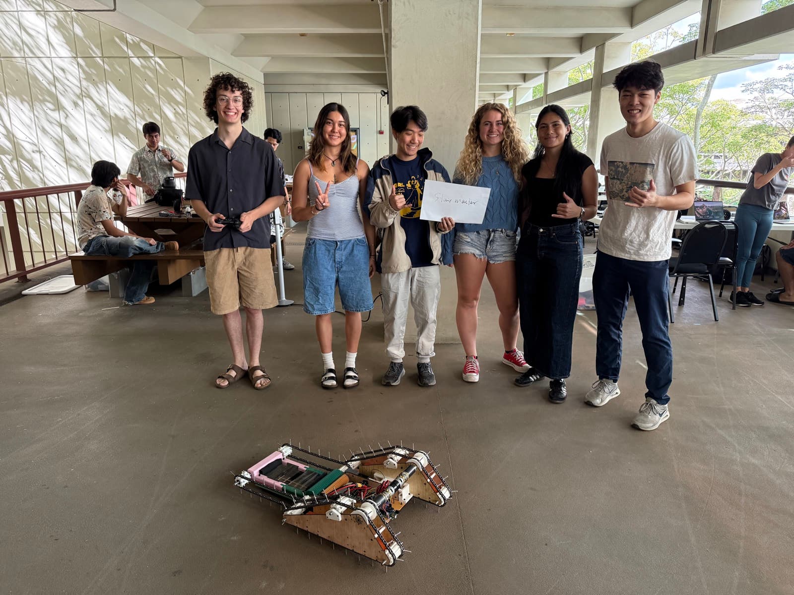 The team, competition day — robot on the floor, controller in hand